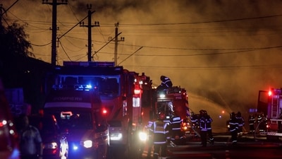 Fire fighters work as flames rise after an explosion at a LPG station in Crevedia, near Bucharest, Romania, on Saturday. (via REUTERS)