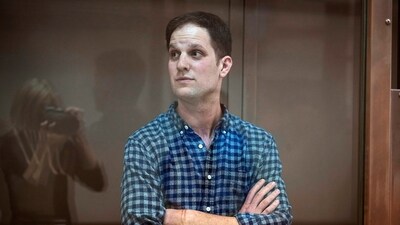Wall Street Journal reporter Evan Gershkovich stands in a glass cage in a courtroom at the Moscow City Court, in Moscow. (AP)
