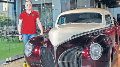 Thane, India - Aug. 23, 2023: Gautam Singhania along with 1935 Lincoln Zephyr(Metallic Maroon & Pearl White )pose for HT at his "SCCG- Super Car Club Garage" at Thane in Thane, India, on Wednesday, August 23, 2023. (Photo by Anshuman Poyrekar/ Hindustan Times) (Hindustan Times) Thane, India - Aug. 23, 2023: Gautam Singhania along with 1935 Lincoln Zephyr(Metallic Maroon & Pearl White )pose for HT at his "SCCG- Super Car Club Garage" at Thane in Thane, India, on Wednesday, August 23, 2023. (Photo by Anshuman Poyrekar/ Hindustan Times) (Hindustan Times)