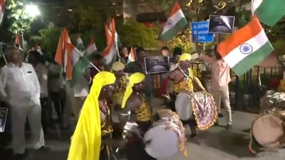 Local artists play dhol and dance on the streets outside HAL airport in Bengaluru to welcome PM Narendra Modi as he will meet scientists of ISRO team involved in the Chandrayaan-3 Mission.. (ANI) Local artists play dhol and dance on the streets outside HAL airport in Bengaluru to welcome PM Narendra Modi as he will meet scientists of ISRO team involved in the Chandrayaan-3 Mission.. (ANI)