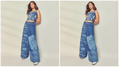 Ananya's denim outfit comes from the shelves of the clothing brand Heavn and features a sweetheart neckline crop top with a buttoned bodice and ripped detailing. She teamed it with a pair of flared denim jeans with a quirky print. (Instagram/@ananyapanday) Ananya's denim outfit comes from the shelves of the clothing brand Heavn and features a sweetheart neckline crop top with a buttoned bodice and ripped detailing. She teamed it with a pair of flared denim jeans with a quirky print. (Instagram/@ananyapanday)