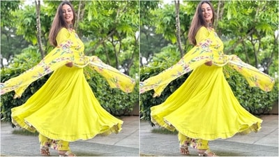 Hina's outfit featured a bright yellow anarkali kurta with full sleeves, deep v-neck, flared hemline and golden gotta patti work on the borders. She paired it with floral printed pants and a matching dupatta. (Instagram/@realhinakhan) Hina's outfit featured a bright yellow anarkali kurta with full sleeves, deep v-neck, flared hemline and golden gotta patti work on the borders. She paired it with floral printed pants and a matching dupatta. (Instagram/@realhinakhan)