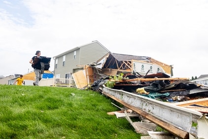 Aiden Kelly, 19, of Comstock Park helps clean up debris with Comstock Park football players in a subdivision off of Pine Island Road in Kent County, Mich. on Friday, Aug. 25, 2023. At least four tornadoes touched down in Michigan as part of severe storms powered by strong winds that killed multiple people, while downing trees, tearing roofs off buildings and leaving hundreds of thousands of customers without power, officials said. (Joel Bissell/Kalamazoo Gazette via AP) (AP) Aiden Kelly, 19, of Comstock Park helps clean up debris with Comstock Park football players in a subdivision off of Pine Island Road in Kent County, Mich. on Friday, Aug. 25, 2023. At least four tornadoes touched down in Michigan as part of severe storms powered by strong winds that killed multiple people, while downing trees, tearing roofs off buildings and leaving hundreds of thousands of customers without power, officials said. (Joel Bissell/Kalamazoo Gazette via AP) (AP)