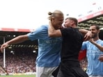 Erling Haaland celebrates scoring the opening goal with a Manchester City fan Erling Haaland celebrates scoring the opening goal with a Manchester City fan