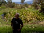 Keʻeaumoku Kapu poses for photos on his taro farm near Lahaina, Hawaii, Wednesday, Aug. 16, 2023. A deadly Maui wildfire is renewing tensions over Maui stream water rights. (AP Photo/Jae C. Hong)