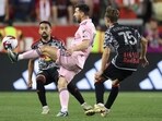 Lionel Messi attempts to control the ball against Daniel Edelman Lionel Messi attempts to control the ball against Daniel Edelman