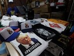 T-shirts and hats with an image depicting the mugshot of former U.S. President Donald Trump are pictured after being printed at the Y-Que printing store in Los Angeles, California, U.S., August 26, 2023. REUTERS/Mario Anzuoni