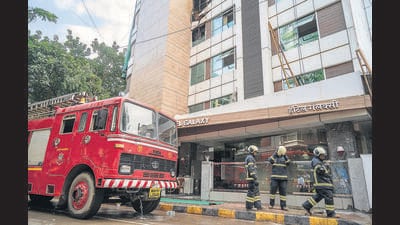 “The fire brigade reached the spot at 1.18 pm,” said P G Dudhaal, divisional fire officer. “We had to rescue eight people. The fire was extinguished with a hydraulic platform, ladder, three small hose lines and one high-pressure first aid line. We’re still investigating the cause.” (Satish Bate/HT PHOTO)