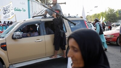 Taliban members celebrate on the second anniversary of the fall of Kabul. (Reuters)