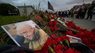 A portrait of the owner of private military company Wagner Group Yevgeny Prigozhin lays at an informal memorial next to the former 'PMC Wagner Centre' in St. Petersburg, Russia, Thursday, Aug. 24, 2023. The final two months of Yevgeny Prigozhin's life are shrouded in mystery. When the Russian mercenary leader staged a mutiny against the country's military in June, President Vladimir Putin decried it as "treason" and vowed punishment. Two months later, Prigozhin's business jet plummeted from the sky. Suspicions arose that the Kremlin was behind the crash and that it was vengeance for the rebellion. The Kremlin denied it. (AP/PTI)(AP08_27_2023_000050A) (AP) A portrait of the owner of private military company Wagner Group Yevgeny Prigozhin lays at an informal memorial next to the former 'PMC Wagner Centre' in St. Petersburg, Russia, Thursday, Aug. 24, 2023. The final two months of Yevgeny Prigozhin's life are shrouded in mystery. When the Russian mercenary leader staged a mutiny against the country's military in June, President Vladimir Putin decried it as "treason" and vowed punishment. Two months later, Prigozhin's business jet plummeted from the sky. Suspicions arose that the Kremlin was behind the crash and that it was vengeance for the rebellion. The Kremlin denied it. (AP/PTI)(AP08_27_2023_000050A) (AP)