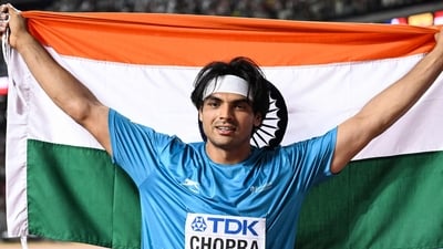 Gold medalist, India's Neeraj Chopra celebrates with his National flag after the men's javelin throw final during the World Athletics Championships at the National Athletics Centre in Budapest on August 27, 2023. (Photo by Kirill KUDRYAVTSEV / AFP) (AFP) Gold medalist, India's Neeraj Chopra celebrates with his National flag after the men's javelin throw final during the World Athletics Championships at the National Athletics Centre in Budapest on August 27, 2023. (Photo by Kirill KUDRYAVTSEV / AFP) (AFP)