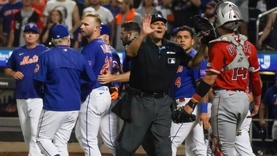 An umpire, center, calls for calm after New York Mets' Pete Alonso, third from left, was hit by a pitch during the eighth inning of a baseball game against the Los Angeles Angels, Saturday, Aug. 26, 2023, in New York. (AP Photo/Bebeto Matthews) (AP) An umpire, center, calls for calm after New York Mets' Pete Alonso, third from left, was hit by a pitch during the eighth inning of a baseball game against the Los Angeles Angels, Saturday, Aug. 26, 2023, in New York. (AP Photo/Bebeto Matthews) (AP)
