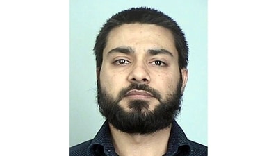 FILE - This booking photo provided by the Sherburne County, Minn., Sheriff's Office shows Muhammad Masood. Masood, the Pakistani doctor and former Mayo Clinic research coordinator who sought to join the Islamic State terrorist group to fight in Syria, was sentenced Friday, Aug. 25, 2023, to 18 years in prison. (Sherburne County Sheriff's Office via AP, File) (AP) FILE - This booking photo provided by the Sherburne County, Minn., Sheriff's Office shows Muhammad Masood. Masood, the Pakistani doctor and former Mayo Clinic research coordinator who sought to join the Islamic State terrorist group to fight in Syria, was sentenced Friday, Aug. 25, 2023, to 18 years in prison. (Sherburne County Sheriff's Office via AP, File) (AP)