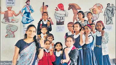 Mrunal Ganjale with her students. During the Covid-19 Pandemic, Ganjale developed a website for her school and provided online education to the students without missing out on a single day. Recently, she was also honoured with Sharad Pawar Inspire Fellowship given by Yashwantrao Chavan Pratishthan for the same. (HT PHOTO) Mrunal Ganjale with her students. During the Covid-19 Pandemic, Ganjale developed a website for her school and provided online education to the students without missing out on a single day. Recently, she was also honoured with Sharad Pawar Inspire Fellowship given by Yashwantrao Chavan Pratishthan for the same. (HT PHOTO)