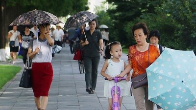 FILE - People walk in the Ryomyong street in Pyongyang, North Korea, Tuesday, Aug. 8, 2023. North Korea said Sunday, Aug. 27, it will allow its citizens staying abroad to return home in line with easing pandemic situations worldwide, as the country slowly eases its draconian pandemic restrictions. (AP Photo/Cha Song Ho, File) (AP) FILE - People walk in the Ryomyong street in Pyongyang, North Korea, Tuesday, Aug. 8, 2023. North Korea said Sunday, Aug. 27, it will allow its citizens staying abroad to return home in line with easing pandemic situations worldwide, as the country slowly eases its draconian pandemic restrictions. (AP Photo/Cha Song Ho, File) (AP)