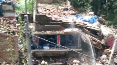 Over 50 houses in the neighbourhood were partially damaged, a senior police officer said, adding that they suspect that several people were still stuck under the rubble. (PTI) Over 50 houses in the neighbourhood were partially damaged, a senior police officer said, adding that they suspect that several people were still stuck under the rubble. (PTI)