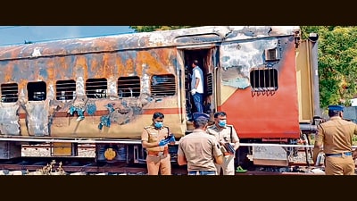 Police personnel stand guard at the site of train fire accident where forensic experts are conducting an investigation for the second day, in Madurai, Sunday, Aug 27, 2023. Nine people were killed and several others injured in the incident. (PTI) Police personnel stand guard at the site of train fire accident where forensic experts are conducting an investigation for the second day, in Madurai, Sunday, Aug 27, 2023. Nine people were killed and several others injured in the incident. (PTI)