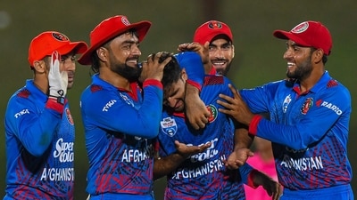Afghanistan's Fazalhaq Farooqi (C) celebrates with teammates after the dismissal of Pakistan's captain Babar Azam (AFP) Afghanistan's Fazalhaq Farooqi (C) celebrates with teammates after the dismissal of Pakistan's captain Babar Azam (AFP)