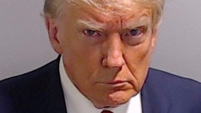 FILE PHOTO: Former U.S. President Donald Trump is shown in a police booking mugshot released by the Fulton County Sheriff's Office, after a Grand Jury brought back indictments against him and 18 of his allies in their attempt to overturn the state's 2020 election results in Atlanta, Georgia, U.S., August 24, 2023. Fulton County Sheriff's Office/Handout via REUTERS  THIS IMAGE HAS BEEN SUPPLIED BY A THIRD PARTY.  THIS PICTURE WAS PROCESSED BY REUTERS TO ENHANCE QUALITY. AN UNPROCESSED VERSION HAS BEEN PROVIDED SEPARATELY./File Photo (via REUTERS)