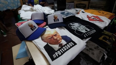 T-shirts and hats with an image depicting the mugshot of former U.S. President Donald Trump are pictured after being printed at the Y-Que printing store in Los Angeles, California, U.S., August 26, 2023. REUTERS/Mario Anzuoni (REUTERS)