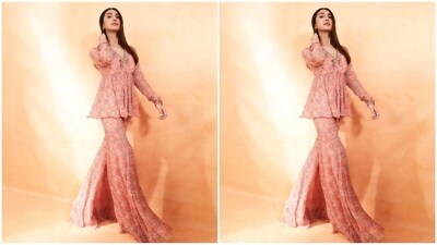 Vaani donned an orange sharara set by designer Ridhi Mehra, which featured a mesmerising floral print all over, a V-neck top with full sleeves and a peplum design. She paired it with a matching sharara. (Instagram/@_vaanikapoor_) Vaani donned an orange sharara set by designer Ridhi Mehra, which featured a mesmerising floral print all over, a V-neck top with full sleeves and a peplum design. She paired it with a matching sharara. (Instagram/@_vaanikapoor_)