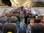 No one thinks about putting on SPF on a plane, but you absolutely have to, as airplane windows don’t protect you fully from the sunlight coming in.  (Photo by Eleonore SENS / AFP)