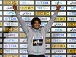India's Neeraj Chopra celebrates on the podium.