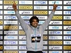 India's Neeraj Chopra celebrates on the podium.