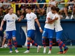FC Barcelona's Gavi celebrates scoring their first goal with Lamine Yamal and teammates