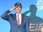 Former Foxconn Founder Terry Gou salutes during a press conference in Taipei on August 28, 2023. Gou announced that he will run for president of Taiwan as an independent candidate. (Photo by Sam Yeh / AFP)