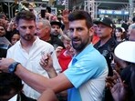 Serbian tennis player Novak Djokovic meets with fans after playing at a pop-up tennis court during a US Open tennis event at Times Square in New York on August 24 Serbian tennis player Novak Djokovic meets with fans after playing at a pop-up tennis court during a US Open tennis event at Times Square in New York on August 24