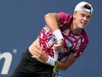 Holger Rune, of Denmark,serves to Roberto Carballes Baena, of Spain, during the first round of the U.S. Open tennis championships