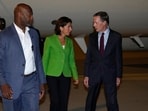 Commerce Secretary Gina Raimondo, center, talks to U.S. Ambassador to China Nicholas Burns, right, as she arrives at the Beijing Capital International Airport in Beijing, Sunday. Commerce Secretary Gina Raimondo, center, talks to U.S. Ambassador to China Nicholas Burns, right, as she arrives at the Beijing Capital International Airport in Beijing, Sunday.