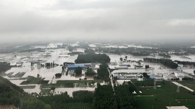 China Rainfall: An aerial view shows flooded farmlands and houses near Tazhao village, following heavy rainfall in Zhuozhou, Hebei province. (Reuters)