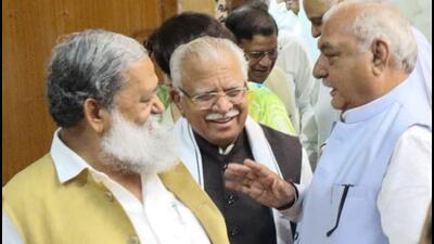 Chief minister Manohar Lal Khattar (centre) interacting with his predecessor and Congress leader Bhupinder Singh Hooda (right) as state home minister Anil Vij looks on at the Haryana Vidhan Sabha in Chandigarh on Monday. (Keshav Singh/HT) Chief minister Manohar Lal Khattar (centre) interacting with his predecessor and Congress leader Bhupinder Singh Hooda (right) as state home minister Anil Vij looks on at the Haryana Vidhan Sabha in Chandigarh on Monday. (Keshav Singh/HT)