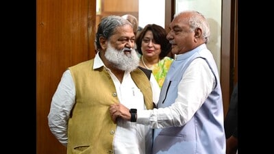 Haryana home minister Anil Vij with CLP leader Bhupinder Singh Hooda at the Vidhan Sabha on Monday.The communal violence in Nuh echoed loudly in Haryana assembly on Monday even as repeated pleas of the Congress to discuss July 31 clashes were rejected by speaker Gian Chand Gupta on the grounds that law doesn’t allow Vidhan Sabha to debate a matter pending before the court. (Keshav Singh/ HT)