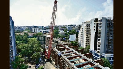 Mumbai, India - Aug 28, 2023 : The BMC wants to remove 13 structures from Gokhale bridge site in Andheri east. Construction of Gokhale Bridge in Andheri east withÊCranesÊatÊwork, in Mumbai, India, Monday, Aug 28, 2023. (Photo by Vijay Bate/HT Photo) Mumbai, India - Aug 28, 2023 : The BMC wants to remove 13 structures from Gokhale bridge site in Andheri east. Construction of Gokhale Bridge in Andheri east withÊCranesÊatÊwork, in Mumbai, India, Monday, Aug 28, 2023. (Photo by Vijay Bate/HT Photo)