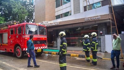 Firefighters outside the Galaxy Hotel after a fire broke out, at Santacruz in Mumbai. (PTI) Firefighters outside the Galaxy Hotel after a fire broke out, at Santacruz in Mumbai. (PTI)