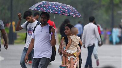 People out in the rain near India Gate in New Delhi. (Raj K Raj/ HT File Photo) People out in the rain near India Gate in New Delhi. (Raj K Raj/ HT File Photo)
