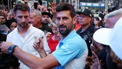 Serbian tennis player Novak Djokovic meets with fans after playing at a pop-up tennis court during a US Open tennis event at Times Square in New York on August 24 (AFP) Serbian tennis player Novak Djokovic meets with fans after playing at a pop-up tennis court during a US Open tennis event at Times Square in New York on August 24 (AFP)