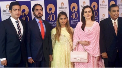 Mukesh Ambani with wife Nita Ambani and children. (PTI) Mukesh Ambani with wife Nita Ambani and children. (PTI)