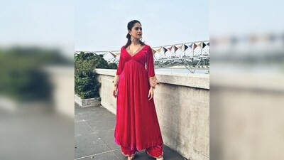 Enhancing her chic look, Nushrratt Bharuccha complements it with pointed golden stilettoes and elegant hoop pearl earrings. (Instagram/@nushrrattbharuccha) Enhancing her chic look, Nushrratt Bharuccha complements it with pointed golden stilettoes and elegant hoop pearl earrings. (Instagram/@nushrrattbharuccha)