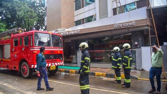 Firefighters outside the Galaxy Hotel after a fire broke out, at Santacruz in Mumbai. (PTI)