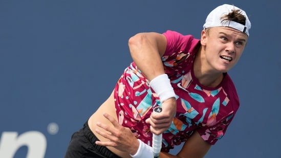 Holger Rune, of Denmark,serves to Roberto Carballes Baena, of Spain, during the first round of the U.S. Open tennis championships (AP)