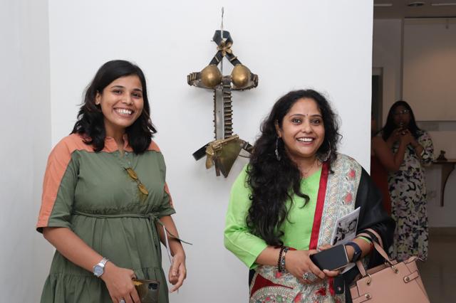 Visitors posing in front of her masterpiece titled Self-Defense.
