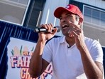 US entrepreneur and 2024 Presidential hopeful Vivek Ramaswamy raps after doing a Fair Side Chat with Governor Kim Reynolds, at the Iowa State Fair in Des Moines, Iowa.