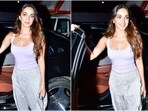 Kiara Advani wears a tank top and baggy pants with minimal makeup for an outing. Kiara Advani wears a tank top and baggy pants with minimal makeup for an outing.