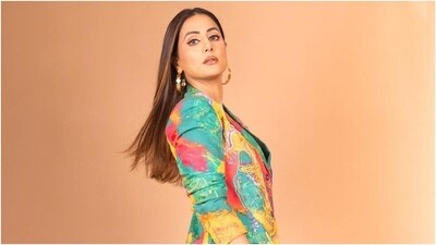 In the end, centre-parted and long silky open tresses gave the finishing touch to Hina Khan's quirky mini blazer dress. You can steal style inspiration from the actor and upgrade your party wardrobe with her glam look. (Instagram) In the end, centre-parted and long silky open tresses gave the finishing touch to Hina Khan's quirky mini blazer dress. You can steal style inspiration from the actor and upgrade your party wardrobe with her glam look. (Instagram)