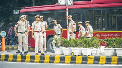 Police keep vigil near a footpath with plants on Tuesday. (Raj K Raj/HT)