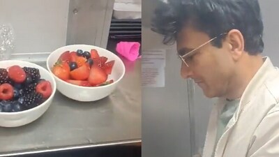 Snapshot of Chef Vikas Khanna chopping fruits to decorate the cake. (Twitter/@Sanjay) Snapshot of Chef Vikas Khanna chopping fruits to decorate the cake. (Twitter/@Sanjay)